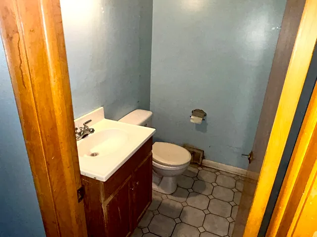 a bathroom with a sink and toilet