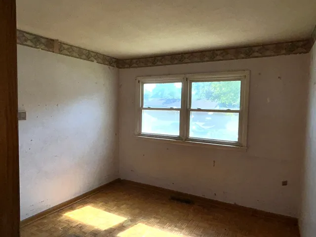 an empty room with windows