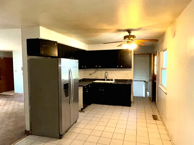 a large bathroom with a bathtub and a shower