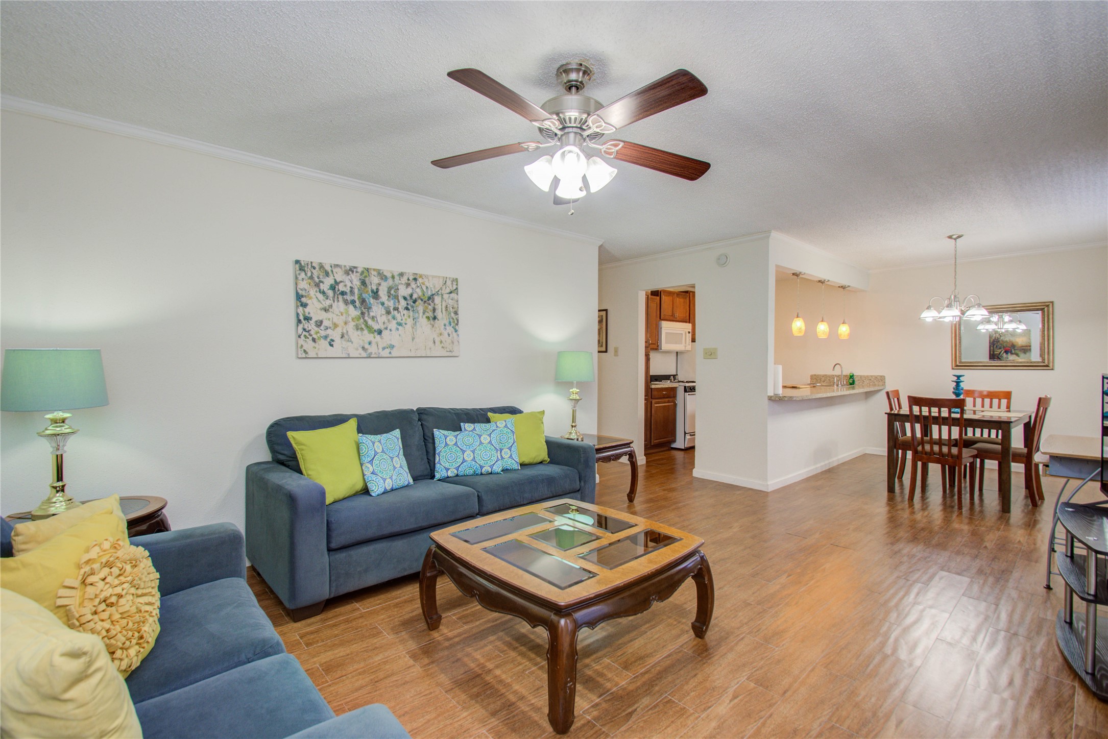 4727 West Alabama Street, Unit 2214 Houston, TX 77027 - Photo 2 of 11 a living room with furniture and a wooden floor