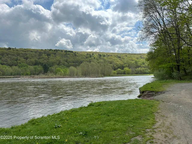 a view of a lake with a big yard