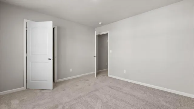 an empty room with closet area