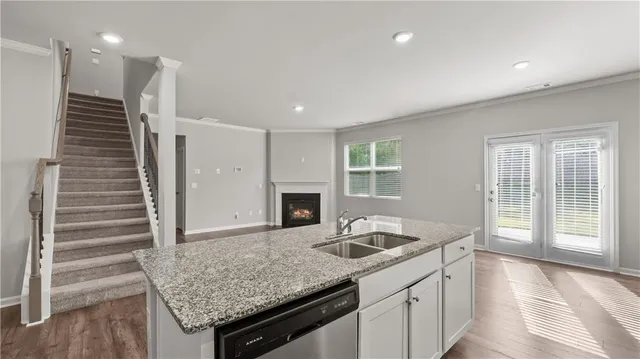 a kitchen with a sink and a refrigerator