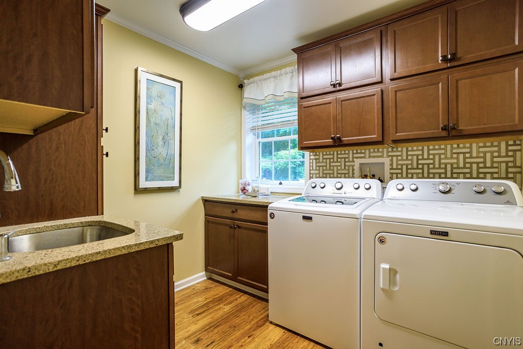 1399 Berry Road Fabius, NY 13084 - Photo 20 of 49 First floor laundry with sink, granite counters an