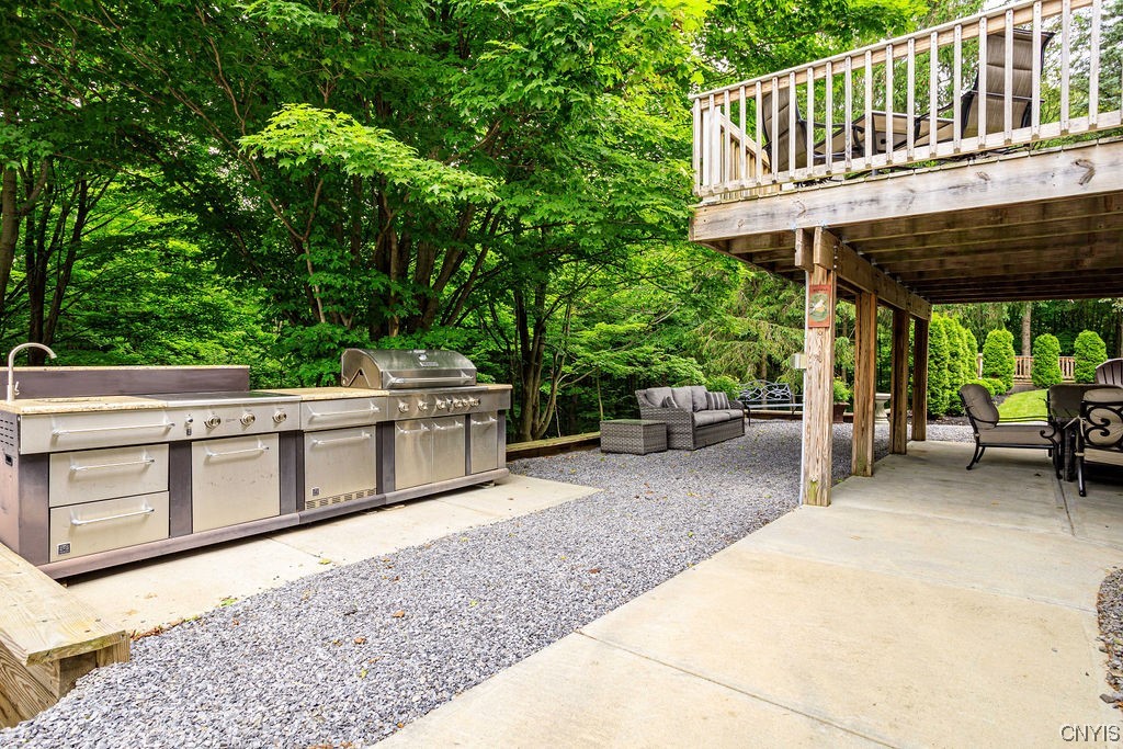 1399 Berry Road Fabius, NY 13084 - Photo 32 of 49 Full outdoor kitchen below the attached deck.