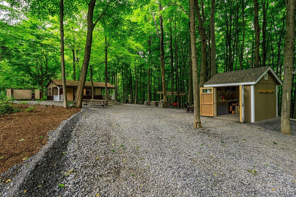 1399 Berry Road Fabius, NY 13084 - Photo 42 of 49 Sleeping cabin #3 to the left and "armory" to the