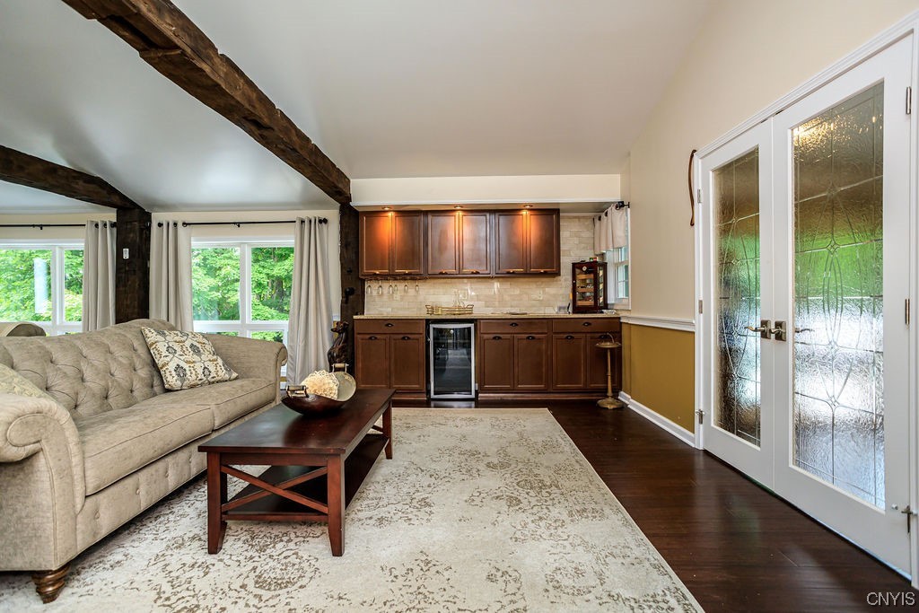 1399 Berry Road Fabius, NY 13084 - Photo 7 of 49 Awesome bar area with wine fridge in living room.