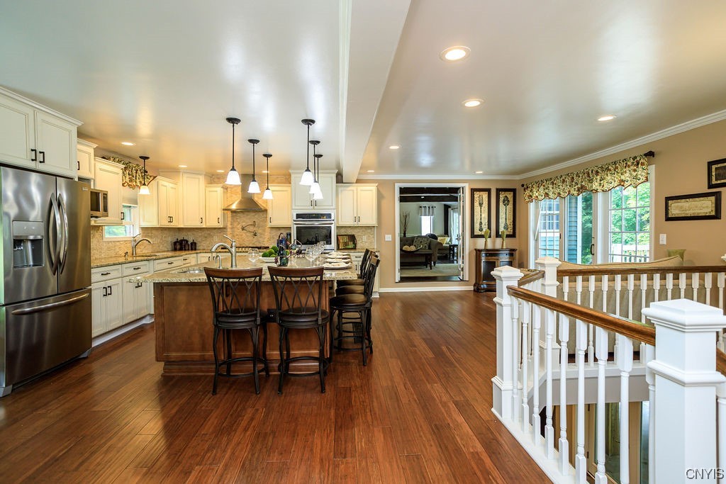 1399 Berry Road Fabius, NY 13084 - Photo 8 of 49 Large and open eat-in kitchen. French doors to the