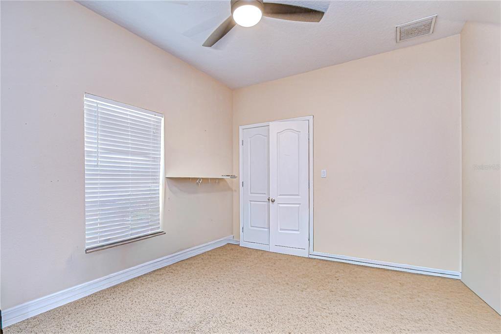 4036 Moores Lake Road Dover, FL 33527 - Photo 14 of 18 an empty room with a window
