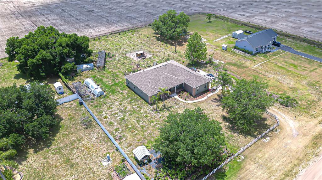 4036 Moores Lake Road Dover, FL 33527 - Photo 16 of 18 an aerial view of a house with a garden