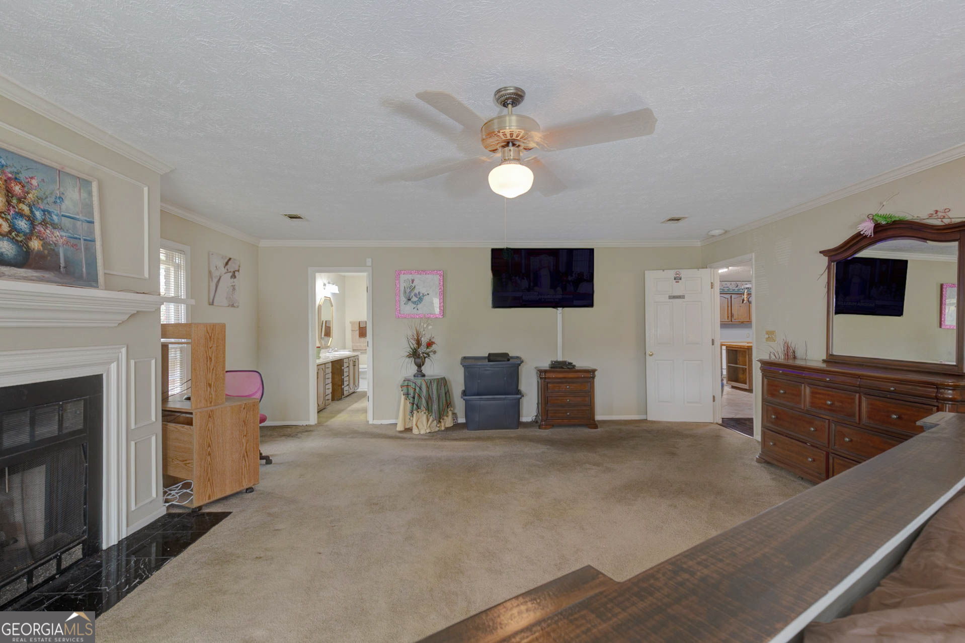 994 Highway 315 Fortson, GA 31808 - Photo 17 of 46 a living room with furniture a fireplace and a flat screen tv