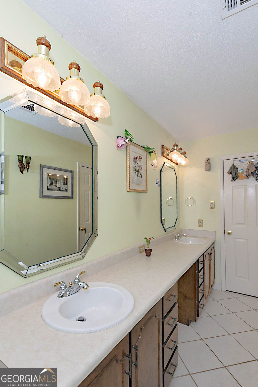 994 Highway 315 Fortson, GA 31808 - Photo 19 of 46 a bathroom with a sink and a mirror