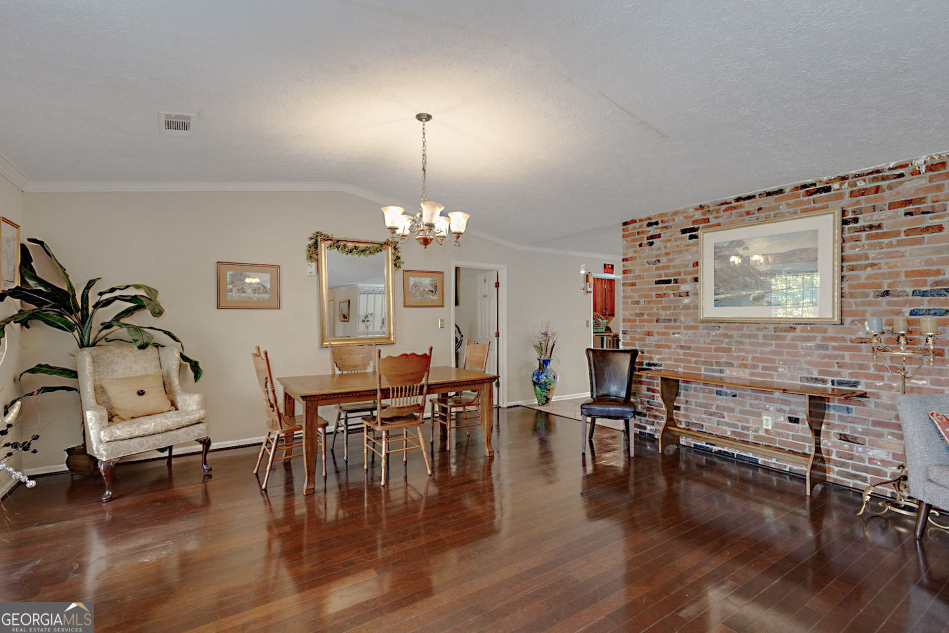 994 Highway 315 Fortson, GA 31808 - Photo 8 of 46 a view of a dining room with furniture chandelier and wooden floor