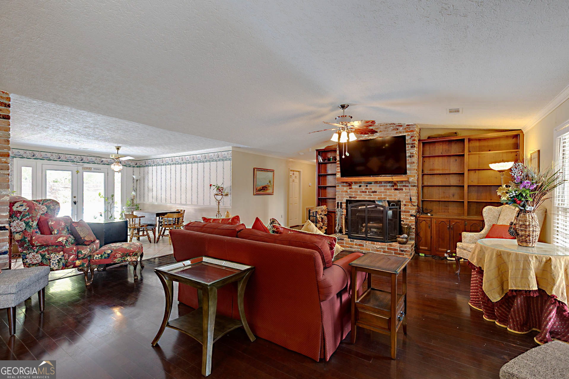 994 Highway 315 Fortson, GA 31808 - Photo 9 of 46 a living room with furniture a fireplace and a flat screen tv