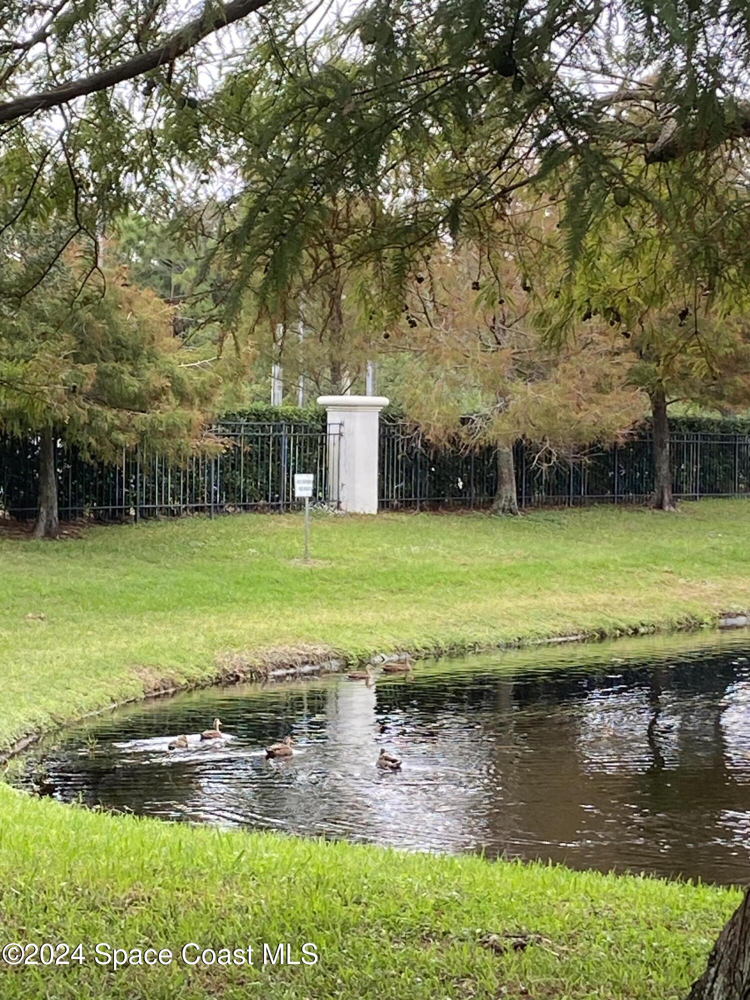 1420 Hampton Park Lane Melbourne, FL 32940 - Photo 15 of 20 a view of a pool with an outdoor space and seating area