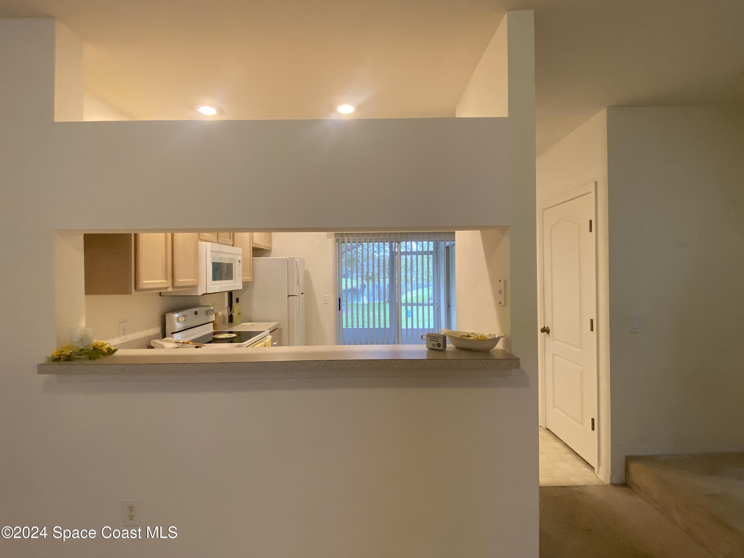 1420 Hampton Park Lane Melbourne, FL 32940 - Photo 3 of 20 a view of empty room with wooden floor
