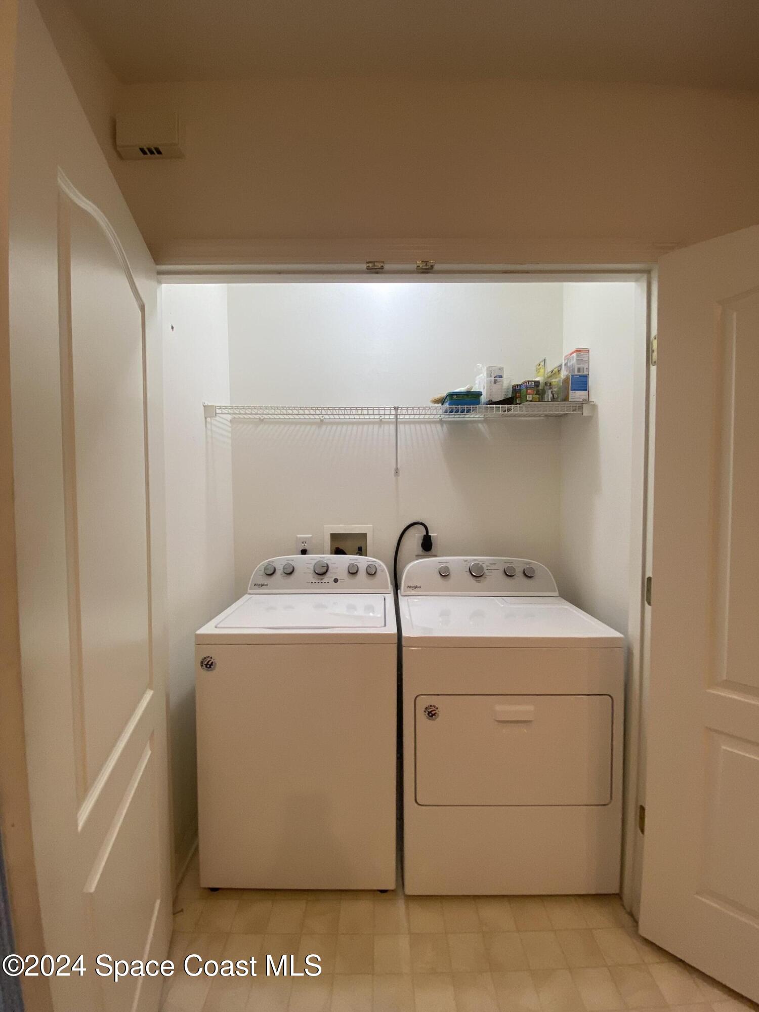 1420 Hampton Park Lane Melbourne, FL 32940 - Photo 7 of 20 a utility room with dryer and washer