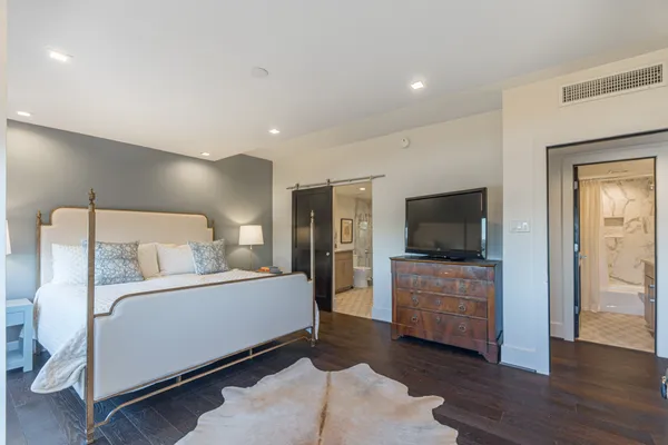 a room with a bed and a television in it