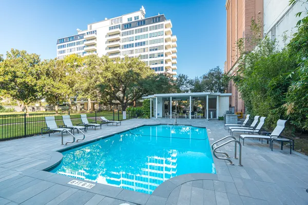 a view of a swimming pool with a patio