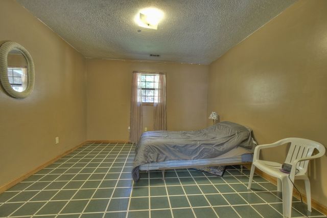 a bedroom with a bed and a closet