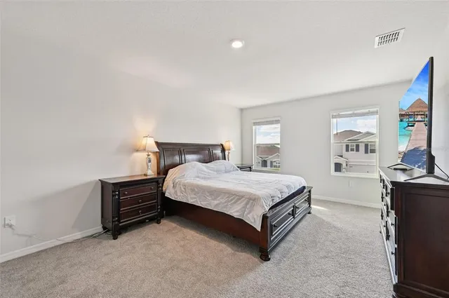 a bedroom with a bed and dresser