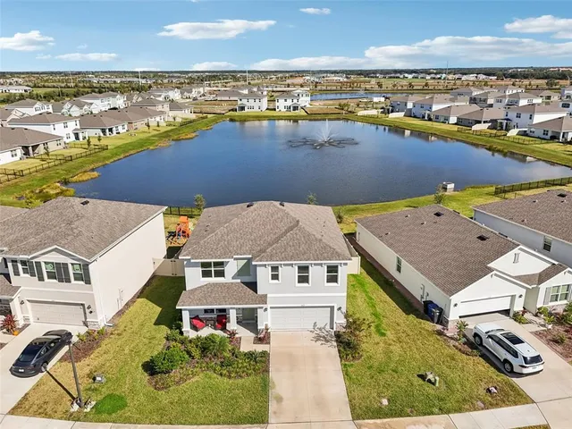 an aerial view of a house with a ocean view