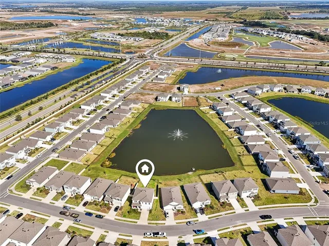 a front view of a building with a garden