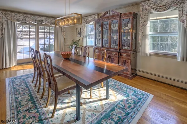 a view of a living room and dining room