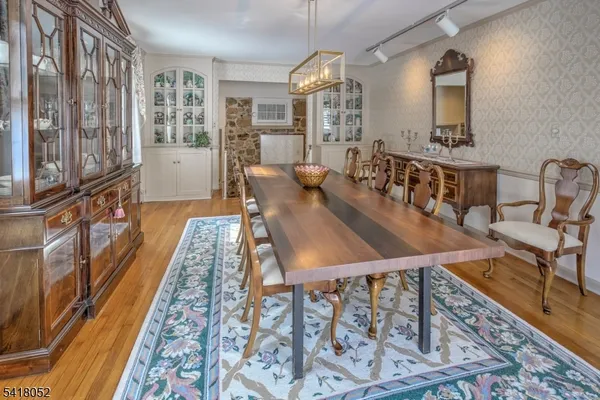 a kitchen with lots of counter top space and wooden floor