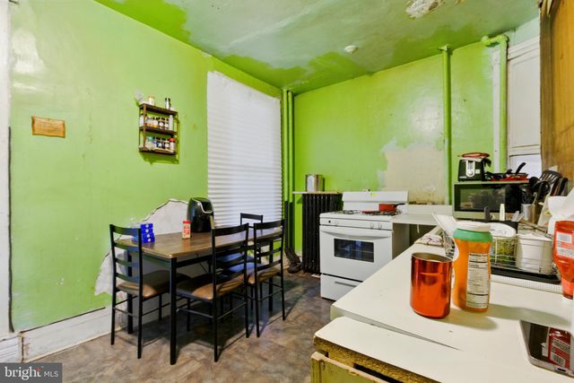 a dining room with furniture and chandelier
