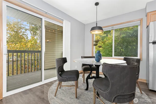 a dining room with furniture window and outside view
