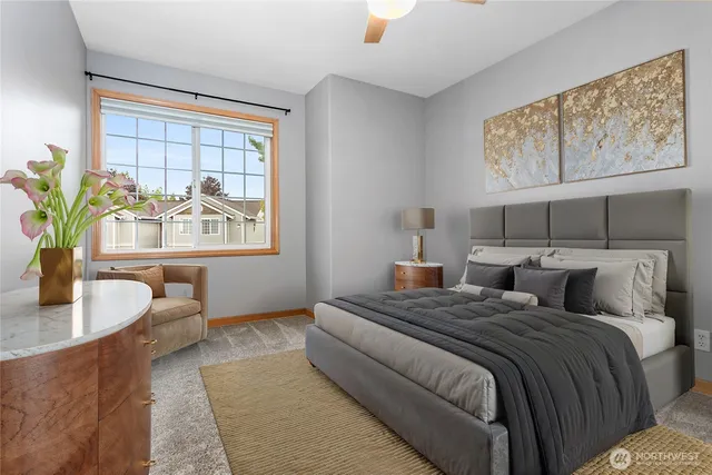 a bedroom with a bed and a couch