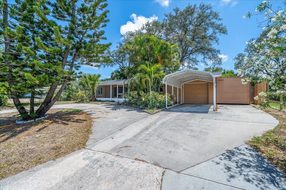 441 Sharon Drive Melbourne, FL 32935 - Photo 1 of 25 front view of a house with a tree