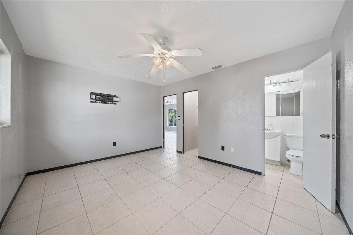 441 Sharon Drive Melbourne, FL 32935 - Photo 11 of 25 a view of an empty room with a bathroom