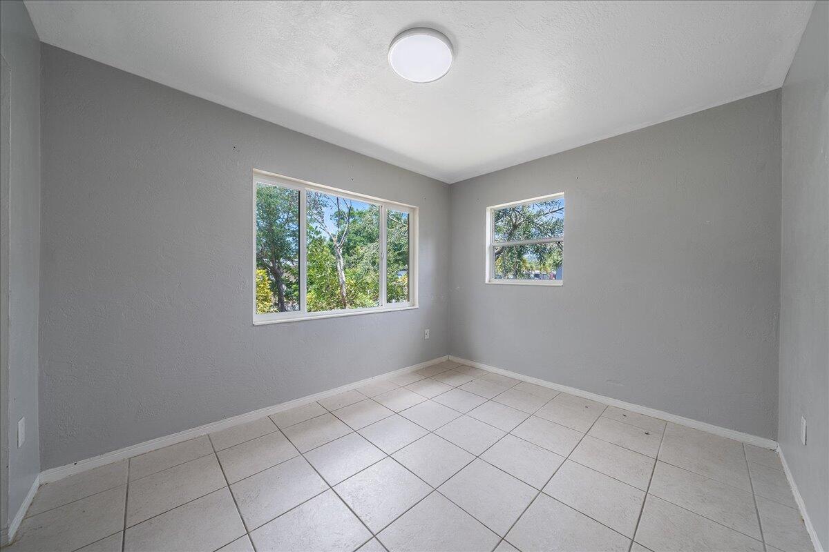 441 Sharon Drive Melbourne, FL 32935 - Photo 13 of 25 an empty room with windows