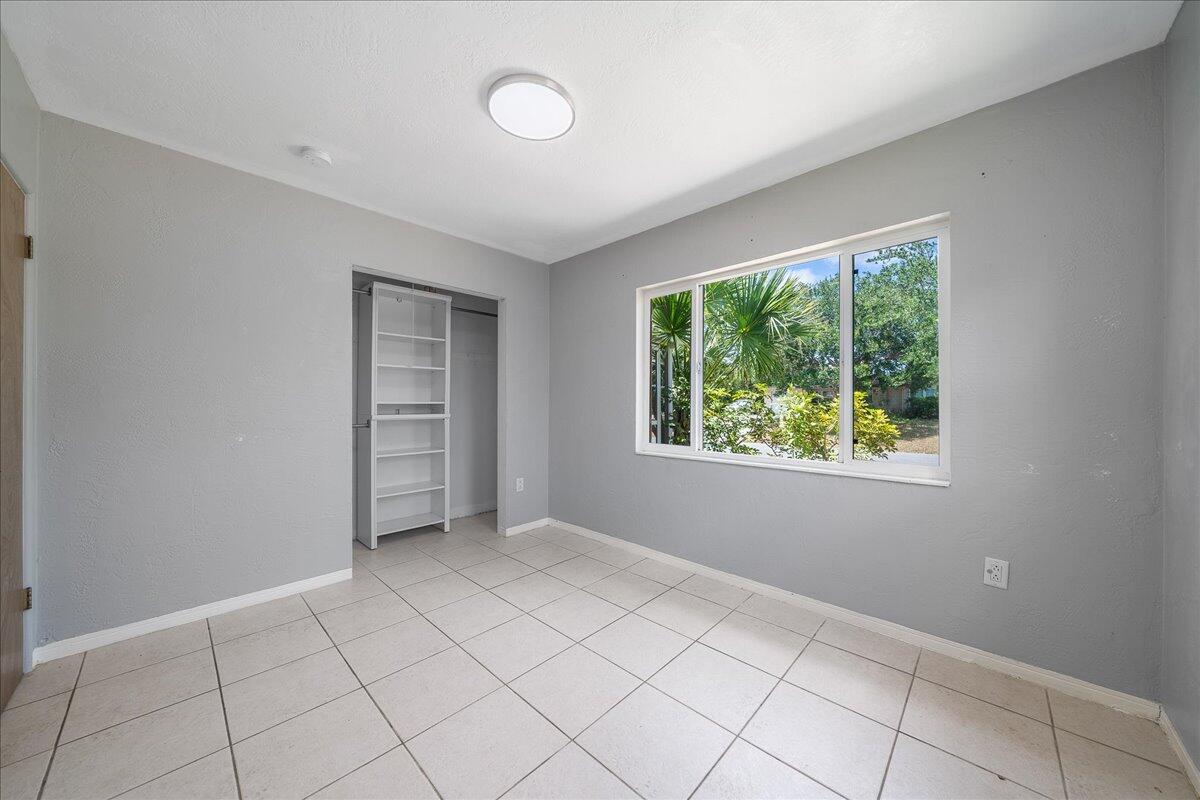 441 Sharon Drive Melbourne, FL 32935 - Photo 16 of 25 an empty room with windows