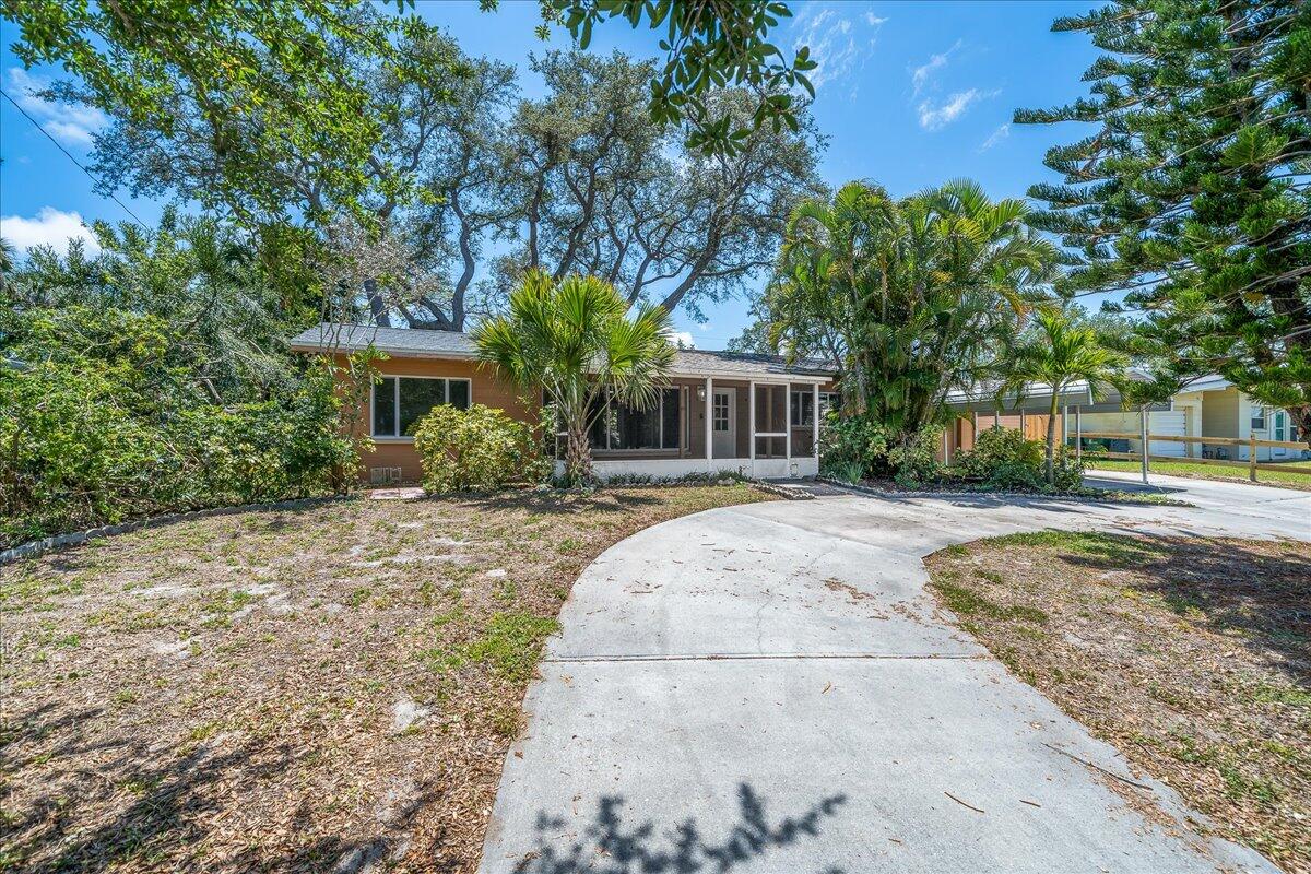 441 Sharon Drive Melbourne, FL 32935 - Photo 2 of 25 a house view with a garden space