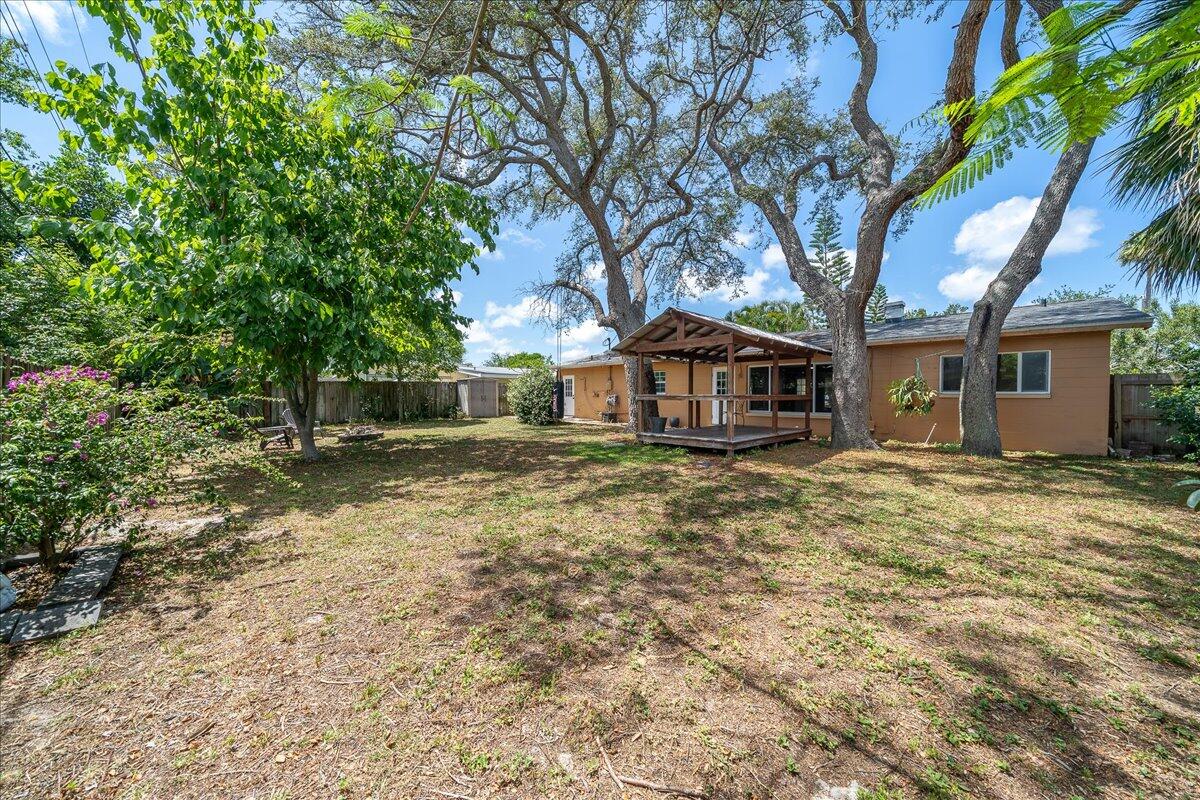 441 Sharon Drive Melbourne, FL 32935 - Photo 22 of 25 a front view of a house with a yard