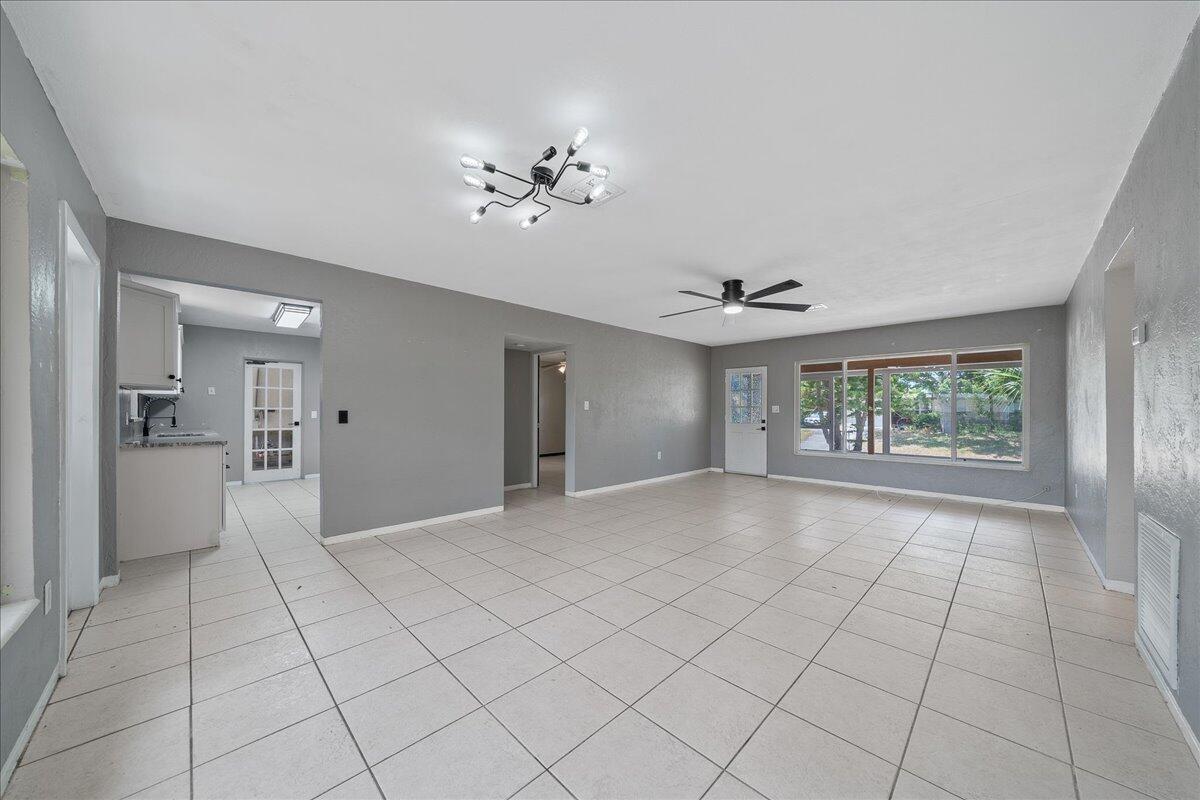 441 Sharon Drive Melbourne, FL 32935 - Photo 4 of 25 a view of an empty room with a window