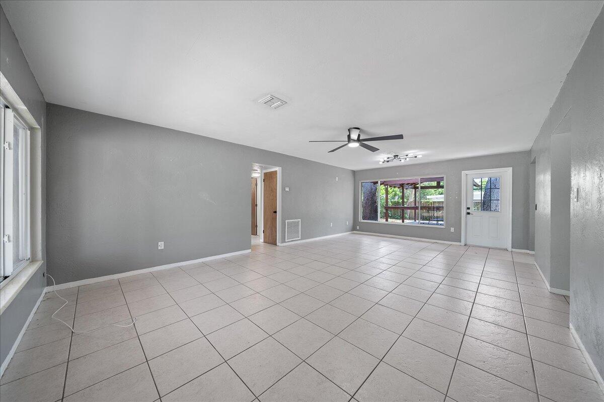 441 Sharon Drive Melbourne, FL 32935 - Photo 5 of 25 a view of an empty room with a window