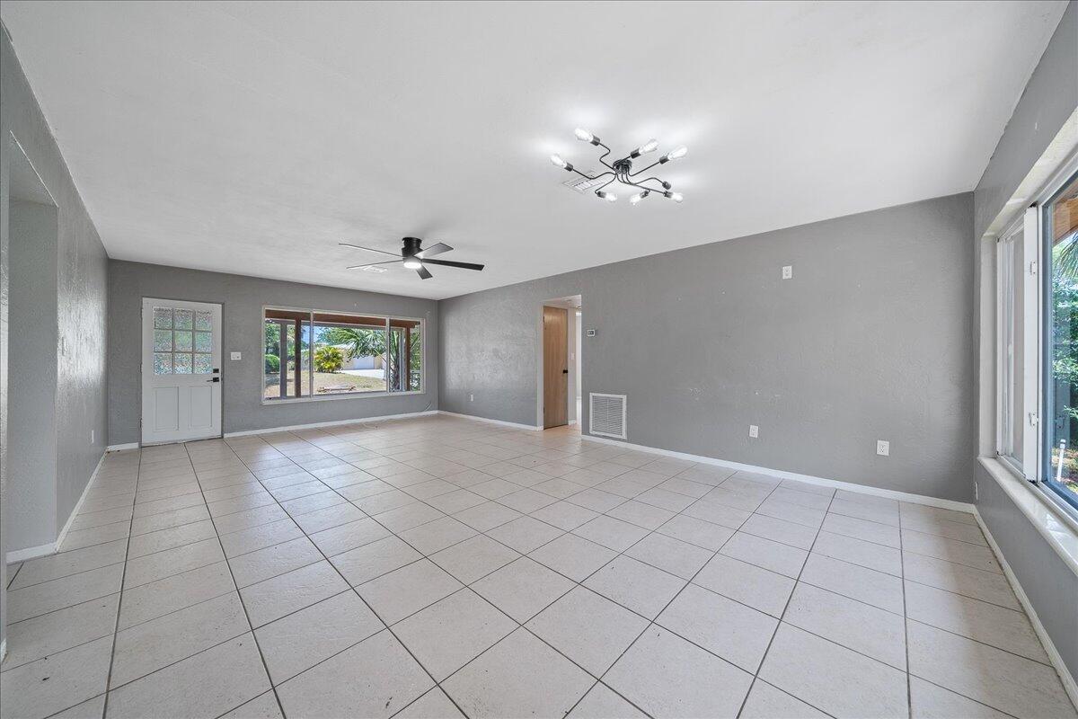 441 Sharon Drive Melbourne, FL 32935 - Photo 6 of 25 a view of an empty room with a window