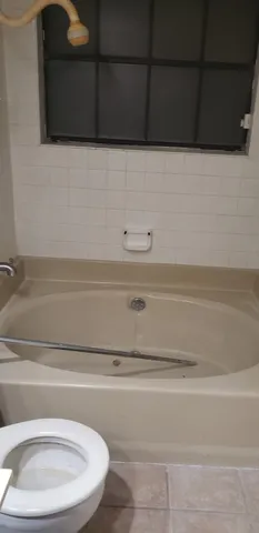 a bathroom with a toilet and a sink