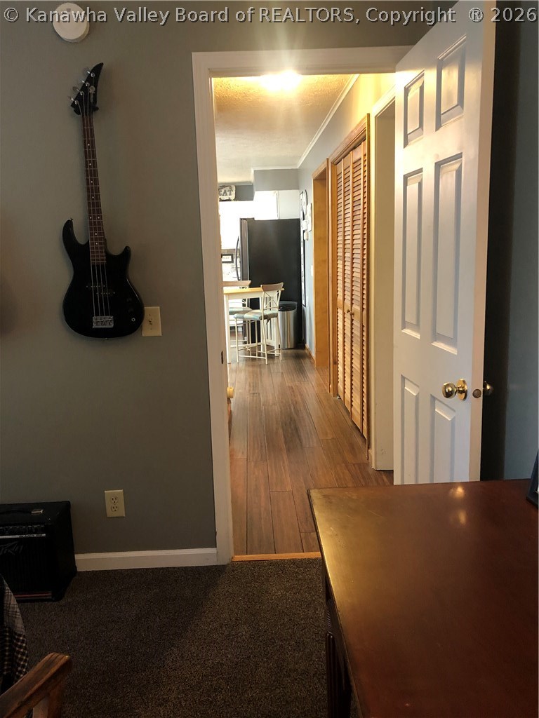 4983 Charleston Road Ripley, WV 25271 - Photo 20 of 25 Bedroom 2 looking down hallway to kitchen