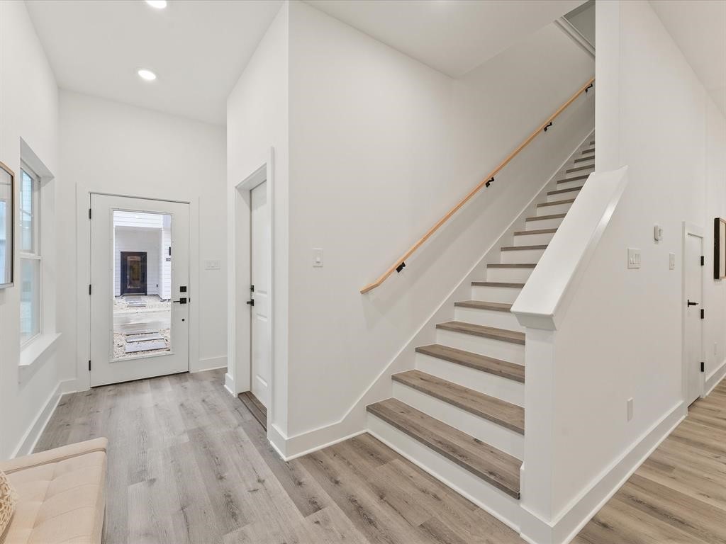 4012 Northfield Lane Houston, TX 77092 - Photo 2 of 17 a view of a hallway with wooden floor and entryway