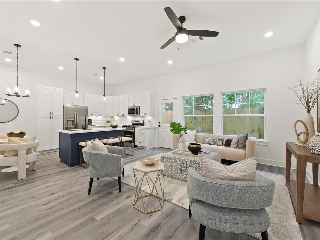 4012 Northfield Lane Houston, TX 77092 - Photo 4 of 17 a living room with furniture and a large window