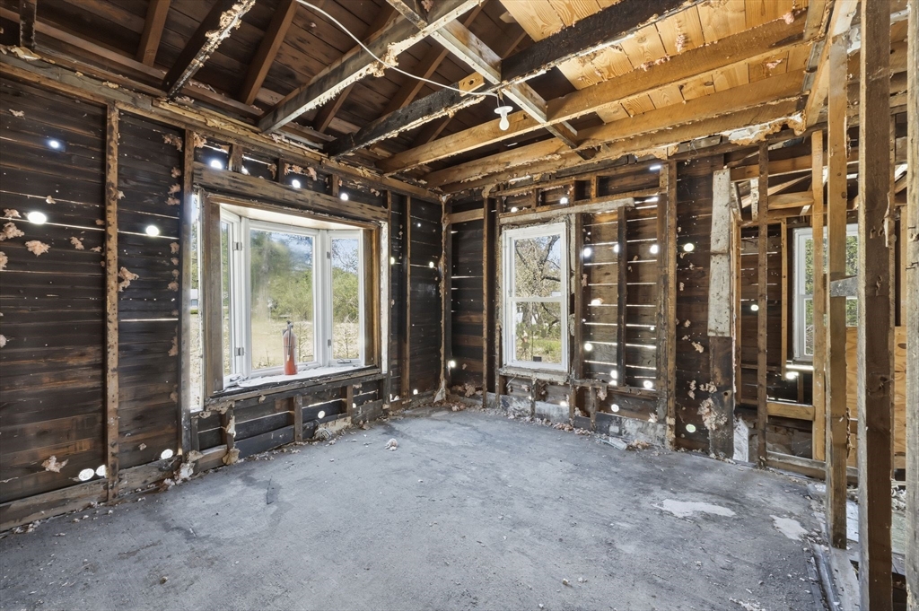 1024 Westhampton Road Northampton, MA 01062 - Photo 12 of 23 a view of an empty room with wooden floor and windows