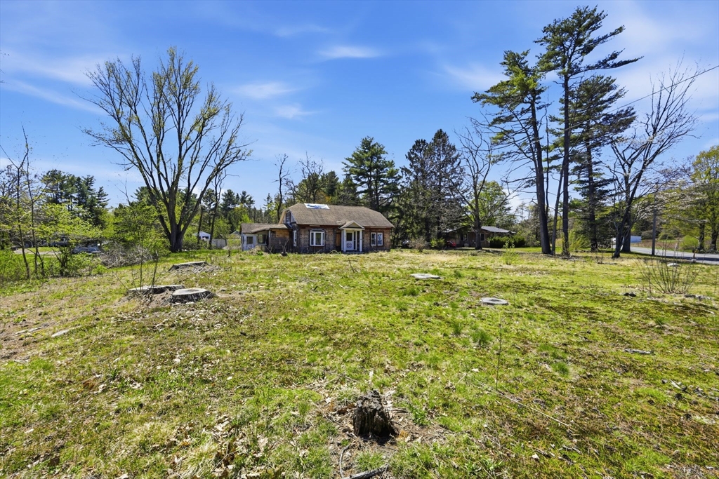 1024 Westhampton Road Northampton, MA 01062 - Photo 5 of 23 a yellow house with trees in front of it