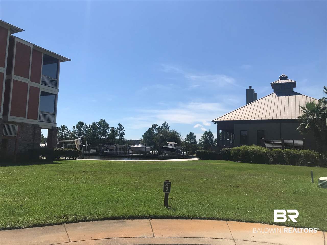 2 Lafitte Boulevard Gulf Shores, AL 36542 - Photo 2 of 19 Canal front lot w/ 46' boat slip. View from road.
