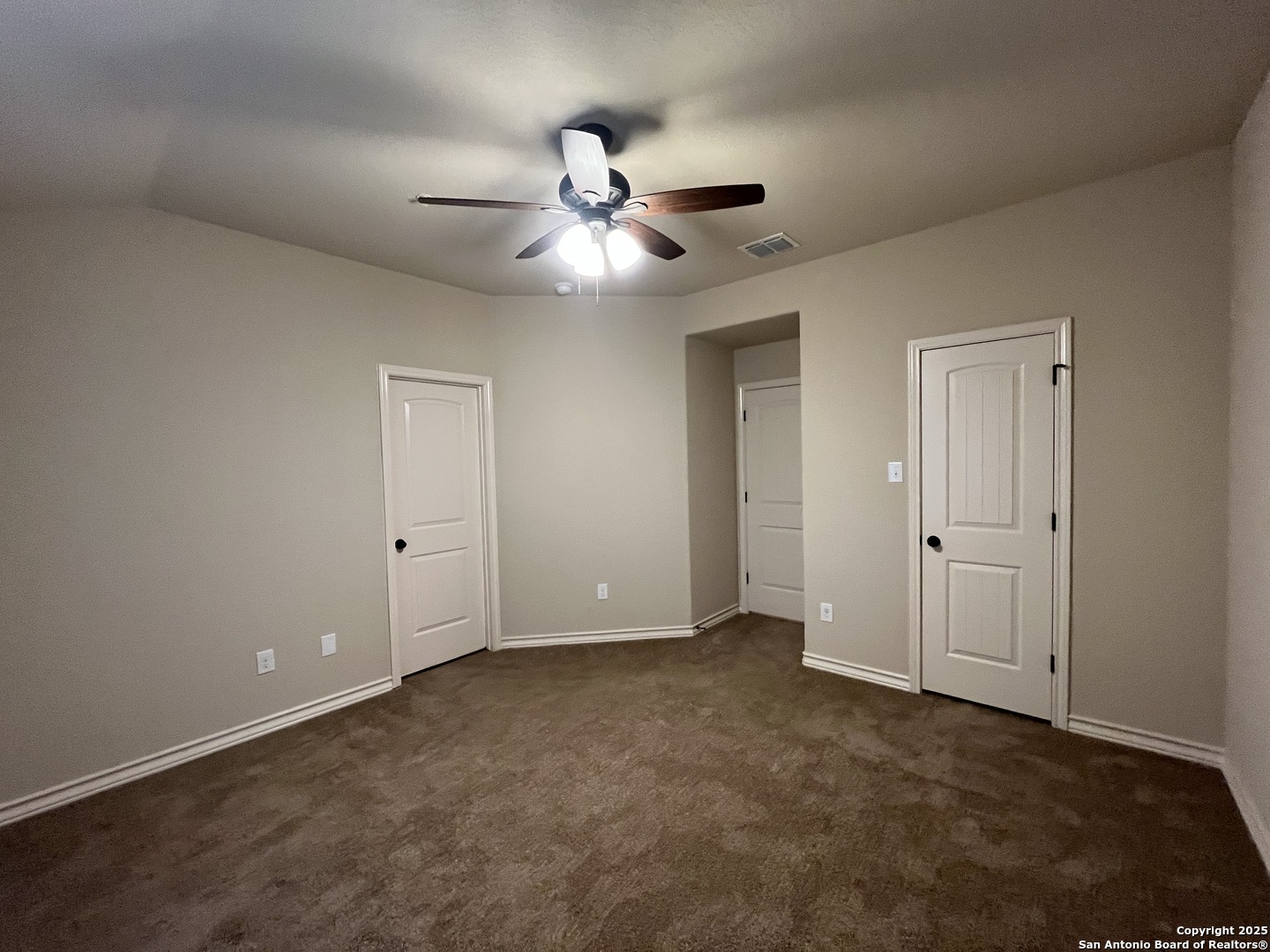 6514 Marcel Way, Unit 103 San Antonio, TX 78233 - Photo 17 of 28 a view of an empty room and a ceiling fan