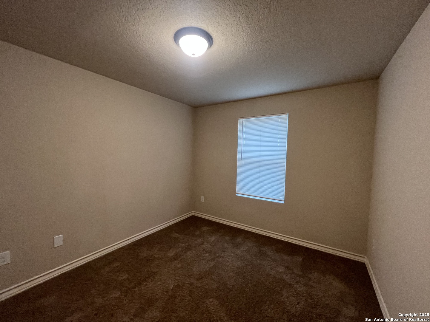6514 Marcel Way, Unit 103 San Antonio, TX 78233 - Photo 21 of 28 an empty room with a window